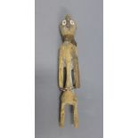 Mumuye, Nigerian wooden figure, with painted eyes, rope twist neck ware and a beaded waistband