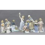 Various Spanish porcelain figures to include six Lladro and three Nao, tallest 28cm (9)