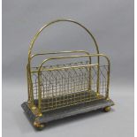 Early 20th century brass letter rack, with bun feet, 33cm