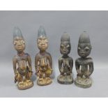 Two pairs of Nigerian Yoruba Ibeji twins, on pair with a male and female and the other pair two