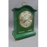 Junghans mantle clock in a green painted wooden case, silvered dial and Arabic numerals, on four