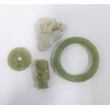Carved jadeite to include a bangle, bi-disc and two plaques, (4)