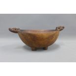 Scandinavian type wooden bowl with carved handles and stile feet, 41cm (a/f)