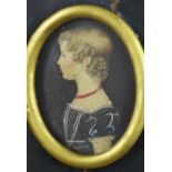 Georgian portrait miniature of a young girl in watercolour, in an oval mount and gilt frame, 5 x 7cm