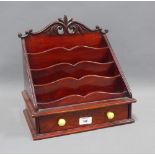 Mahogany stationery / letter rack, with scrolling top and a drawer to the base