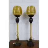 Pair of reproduction Art Deco style table lamp with resin globular shades, purchased from Theodore