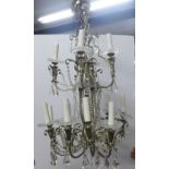 French silvered metal and cut glass twelve light, two tier chandelier