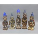 Five Nigerian Yoruba Ibeji twin figures, comprising two pairs of male and female figures and one