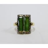 9ct gold dress ring with two emerald cut green stone within a surround of claw set diamonds