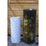 Fruit painted wooden stick stand and a white glazed pottery stand with basket weave texture, tallest