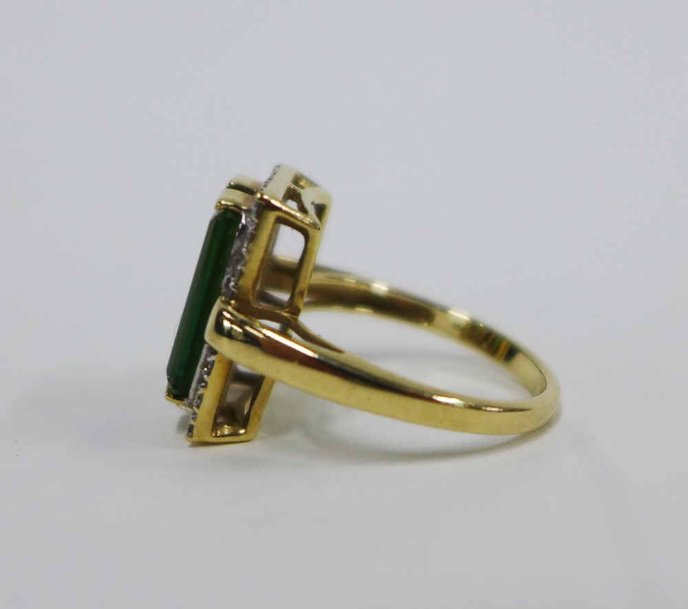 9ct gold dress ring with two emerald cut green stone within a surround of claw set diamonds - Image 2 of 4