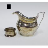 Georgian silver cream jug, London circa 1806, hallmarks partially rubbed, 9cm, and a Birmingham