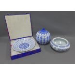 Collection of modern chinoiserie blue and white items to include a jar and cover, bowl and a charger