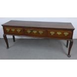 Antique dark oak dresser base / sideboard with three drawers with brass handles, on bold cabriole