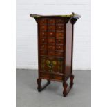 Small Korean style chest / cabinet with altar style top above an arrangement of eighteen small