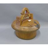 Vietnamese wooden tub, with a detachable cover and stylised pierced handle, height 32cm