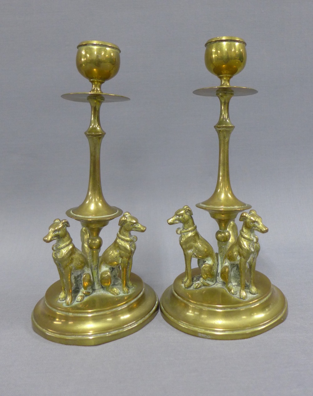 Pair of brass knop stemmed candlesticks, the circular bases with three hounds, 19cm (2) - Image 2 of 2