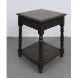 Carved oak table, square top and floral carved frieze, with conforming undertier and turned legs, 48