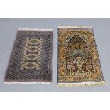 Two Eastern prayer mats, one of Bokhara design the other a garden pattern, largest is 97 x 62cm (2)