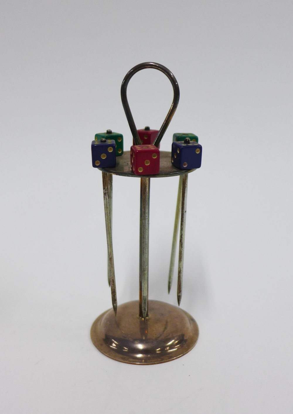 Novelty set of six Epns dice cocktail sticks in a circular stand, 13cm high