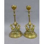 Pair of brass knop stemmed candlesticks, the circular bases with three hounds, 19cm (2)