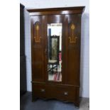 Early 20th century wardrobe with inlaid tulip motifs and a central mirrored door