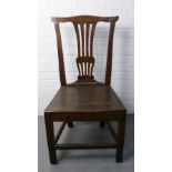 A provincial oak side chair with a curved top rail, pierced splat back, solid seat, square legs