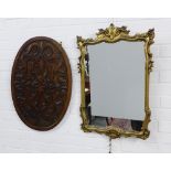 Carved oak panel and an ornate faux giltwood wall mirror, 48 x 72cm (2)