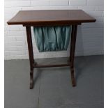 Mahogany sewing table, rectangular top over a blue fabric work bag, on twin supports with splayed