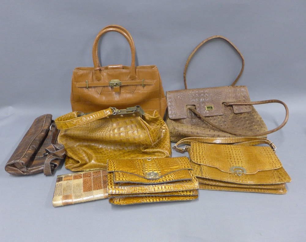 A collection of faux animal skin handbags, a vintage suitcase and a tapestry style Gladstone bag, (a