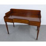 Flame mahogany ledgeback desk, the rectangular top with a lift up compartment, single frieze drawer,