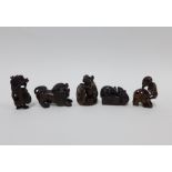 A collection of five wooden netsukes to include a lion, dragon, skeleton, and rats, longest 6cm (5)
