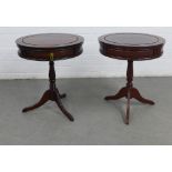 A near pair of mahogany reproduction drum tables, each with a drawer to the frieze, on baluster