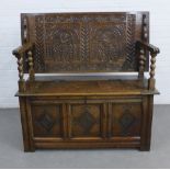 Carved oak Monks bench of traditional form, 131 x 122 x 49cm