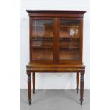 Victorian mahogany cabinet on stand, with a stepped pediment top over a pair of glazed doors with