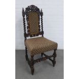Oak chair with carved top rail, upholstered back and seat and with barley twist uprights and