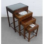 Nest of four chinoiserie hardwood tables with glass protectors to the tops, largest 49 x 70 x