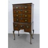 Mahogany chest on stand, rectangular top with a moulded edge over two short and three graduating