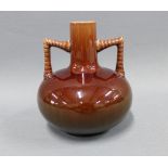 Christopher Dresser style brown glazed vase with stylised handles, 13cm