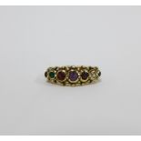 9ct gold acrostic gemset ring, set with a row of seven gemstones; ruby, emerald, garnet. amethyst,
