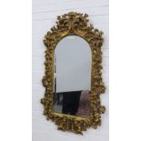 Faux giltwood wall mirror with a moulded resin frame, 115 x 66cm