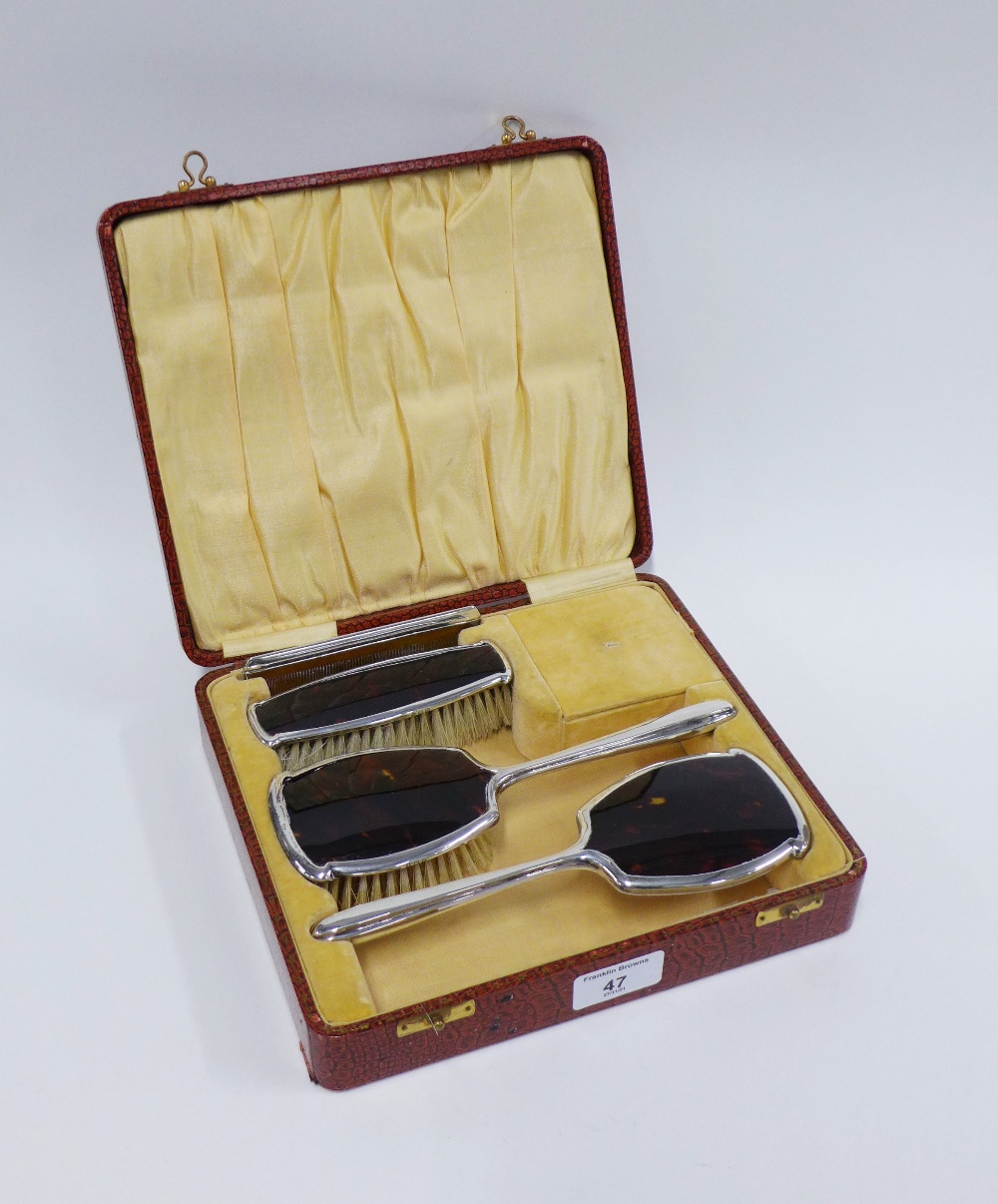 Four piece silver mounted dressing table brush set, Birmingham 1927, in fitted case