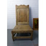 Antique pine chair with a scrolling top rail, panelled back and solid seat (a/f evidence of worm) 95