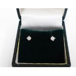 A pair of 9ct gold and diamond stud earrings.