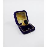 18ct gold ring with an oval black hardstone plaque, stamped 750 UK ring size O