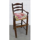 Child's elm ladderback high chair with a woven seat and loose upholstered cushion, 39 x 90cm