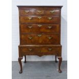 WITHDRAWN Walnut chest on stand, the rectangular top over three short and three graduating long