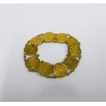 Japanese gold Yen coin bracelet, with ten coins on a chain, clasp fitting.