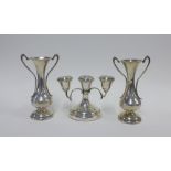 A pair of George V silver vases, Birmingham 1912 together with a silver candelabra, Birmingham,
