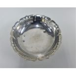 Japanese silver bowl with pierced top rim, on three leaf shaped feet, stamped to the base, 18cm